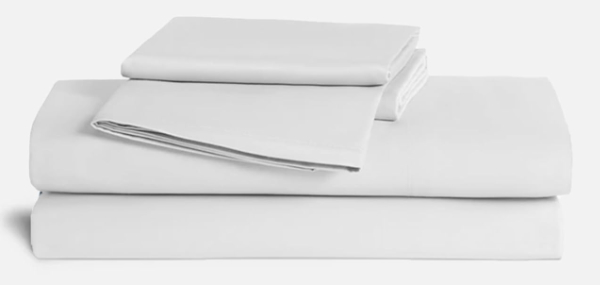 Brooklinen Luxe Core Sateen Sheets in white showing smooth drape