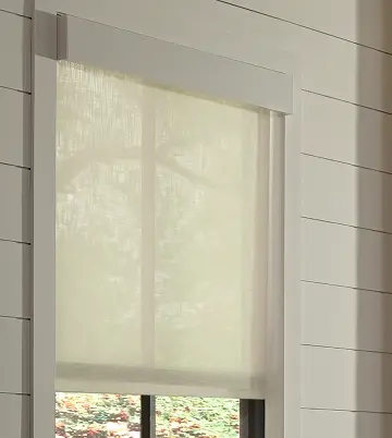 Lutron Serena motorized roller shade in a modern living room