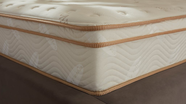 Saatva Classic Mattress featuring a gold-tufted Euro pillow top and dual-coil construction