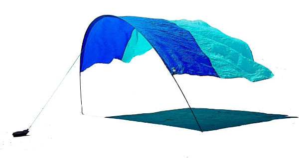 Shibumi Shade blue and teal beach shade floating in the wind