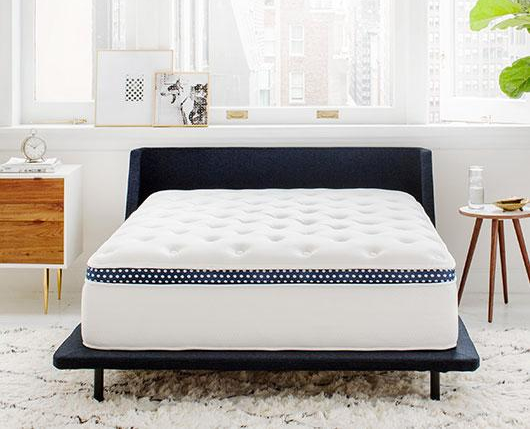 The WinkBed mattress showing its Tencel cover and multi-layer hybrid interior